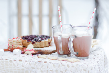 Christmas still life with berry pie cookies and marshmallows in cocoa drink
