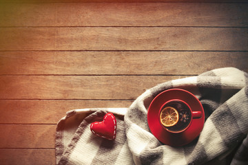 Cup of tea and scarf with heart shapes