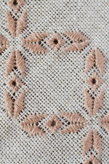 Craft embroidery by brown and beige threads.