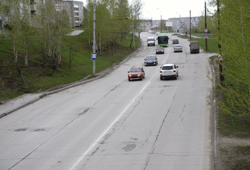 Highway traffic in sunset with cars and trucks