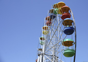 Ferris Wheel Over Blue Sky