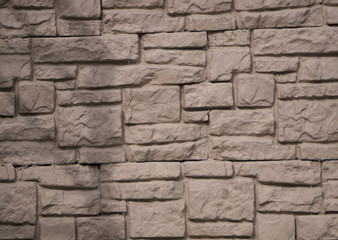 Stone and brick facades of buildings, stone and brick backgrounds and textures for designers