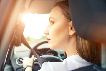 Young business woman driving car in travel vacation