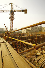 Naklejka premium worker in the construction site making reinforcement metal framework for concrete pouring
