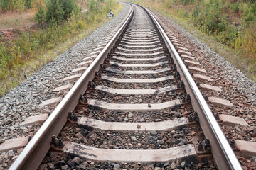 Fototapeta premium Old rails in landscape. Rails ina the land.