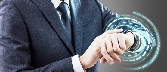 Man using his smartwatch with virtual hologram