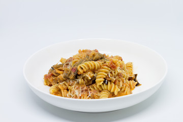 Pasta Sweet Tomato, Aubergine and Ricotta. White background. White plate. Isolated.
