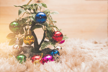 Christmas colorful ball decorative on tree with white carpet