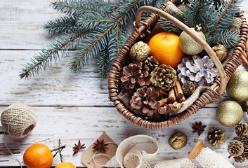 Vintage basket with Christmas festive decoration. Overhead view.Copy space