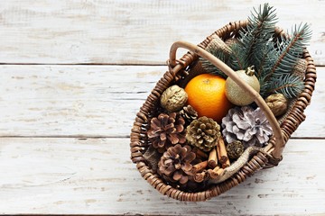 Vintage basket with Christmas festive decoration. Overhead view.Copy space