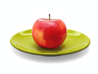 Red apple on green plate, healthy food