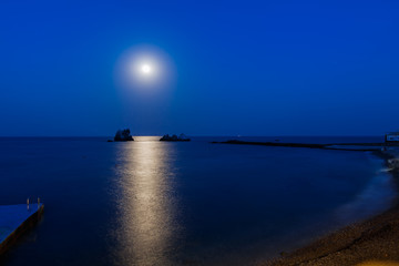 Fototapeta premium Camel rocks and three sisters at night/ view of the rocks Camel and three sisters at night, in the light of the moon, Southern coast of Crimea