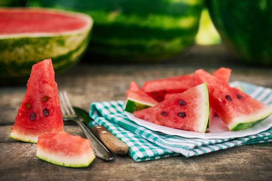 Sliced watermelon on table and plate