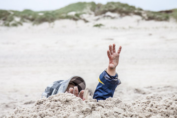 Young boy playing on the beach