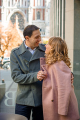 Happy middle age couple in love having fun outdoors and smiling. Romantic happy couple kissing and hugging. Sentimental happy couple in love bonding