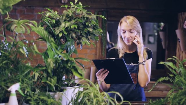 female florist consults the client by phone