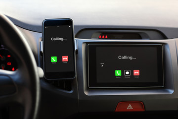 Phone and multimedia system phone calling on screen in car.