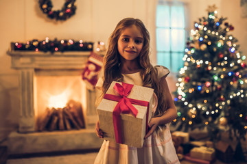 Obraz na płótnie Canvas Little girl waiting for Christmas