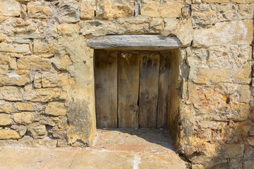 Fototapeta na wymiar Door in an old stone facade