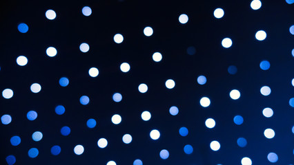 Defocused lights at night making white bokeh