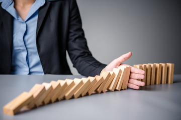 Close up Woman hand arranging wood block stacking as step stair. Business concept growth success process.