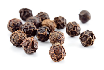 Peppercorn isolated. Peppercorns on white background. Black pepper macro. Soft focus.