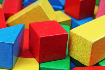 Wooden toy block background. Red, Blue, Yellow Green Wooden toy blocks on white background. Wood block texture pattern.