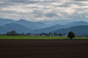 The farmlands of the Mur river valley and the mountains in the background