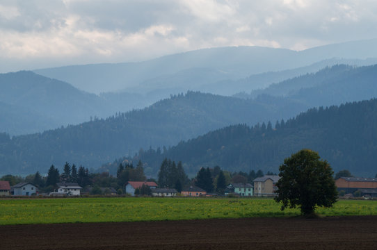 Arable land with hills and mountains in the background
