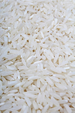 Rice background. Rice texture basmati long pattern, white raw uncooked rice closeup