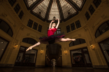 Ballerina Natalia Horsnell doing a split jump in the Oktogon public urban passageway in Zagreb, Croatia.