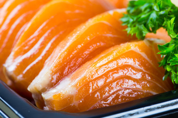 Salmon fish in plastic box