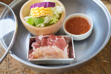 Sliced pork and vegetables in hot pot