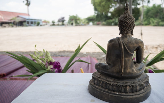 Back side Buddha statue on blur background