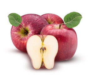 Red and green apples one cut in half with leaf with water drops