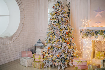 Christmas tree and fireplace in the lights