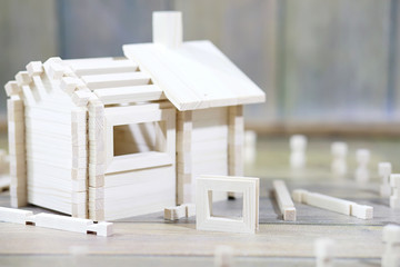 Toy wooden house. The constructor is made of natural wood for ch