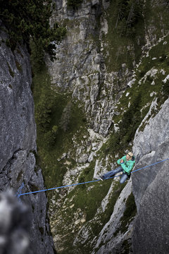 Man balancing on highline between two rocks, Germany