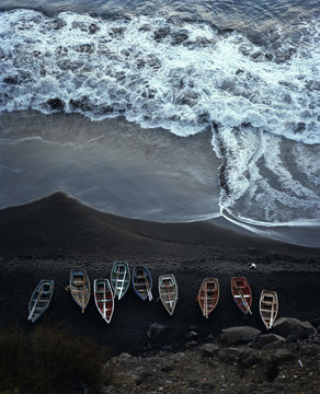 Fishing boats on lava beach, Ilhas do Sotavento, Cape Verde