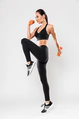 Poster Full length portrait of a healthy young asian fitness woman © Drobot Dean