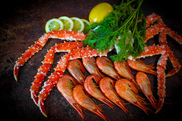 Seafood. Crab Legs. crab legs with fresh lemon © EwaStudio