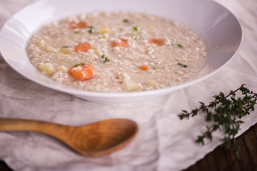 close up of a healthy taste barley soup with root vegetables