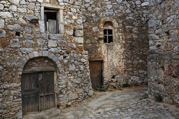 Fototapeta na wymiar Old traditional abandoned stone houses in Avgonima village on Chios island in Greece. 
