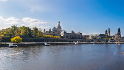 Fototapeta na wymiar Scenic autumn view of Elbe river, Augustus Bridge and Old Town, Dresden, Saxony, Germany, Europe