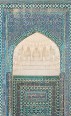 Wall with an arch and the dome in traditional Asian mosaic. the details of the architecture of medieval Central Asia