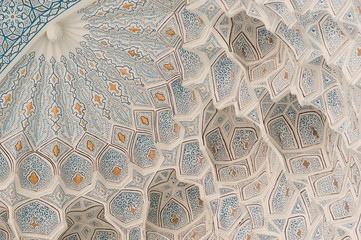 Semicircular ceiling carved with ancient Asian ornament. the details of the architecture of...