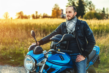 Man on sport motorcycle outdoor on the road