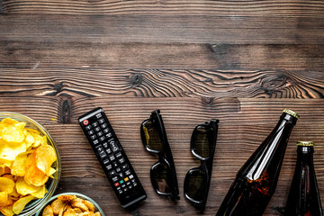 snacks for watching TV on wooden background top view mock-up