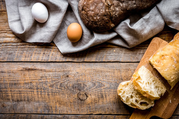 bakery concept with homemade bread on rustic background top view