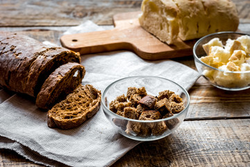 traditional sliced bread with crumbs wooden table background